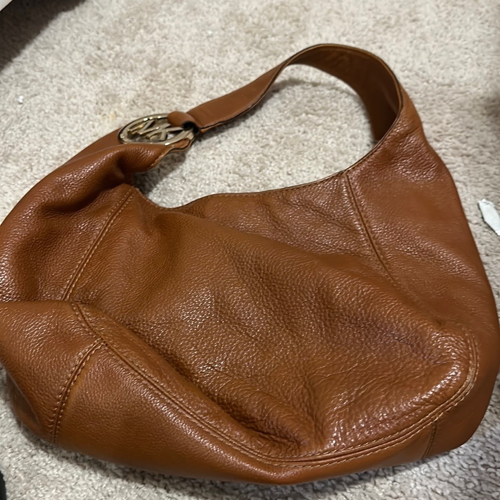 Pebble grain brown leather hobo. Good condition